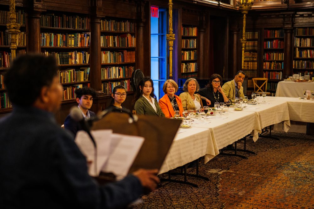 Guests seated at dinner during the moderated discussion