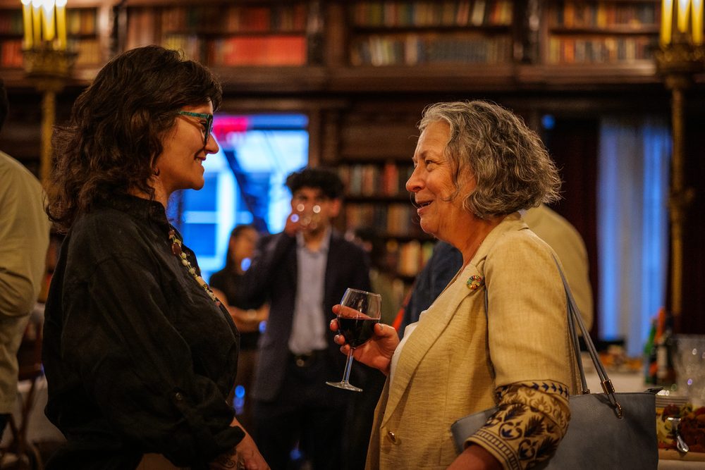 Two guests in conversation during the reception